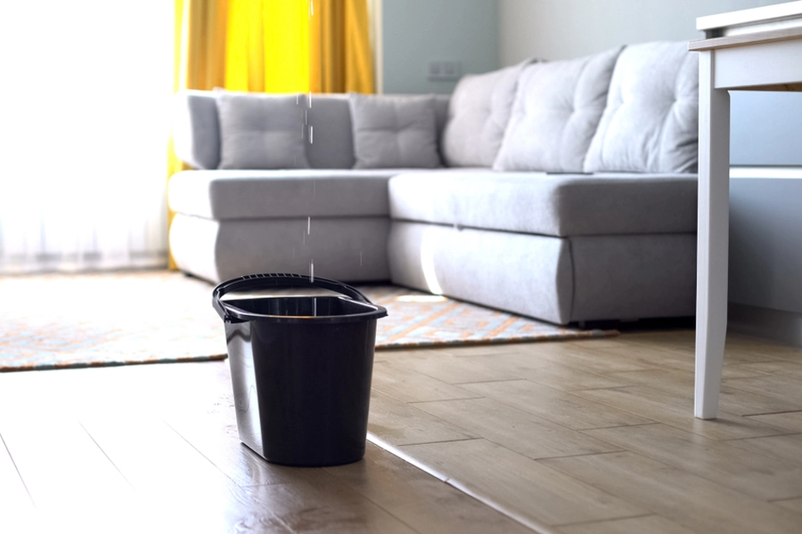 Roof leak damage visible on an interior ceiling after a storm