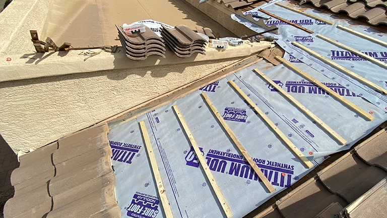 Roof underlayment exposed during tile removal