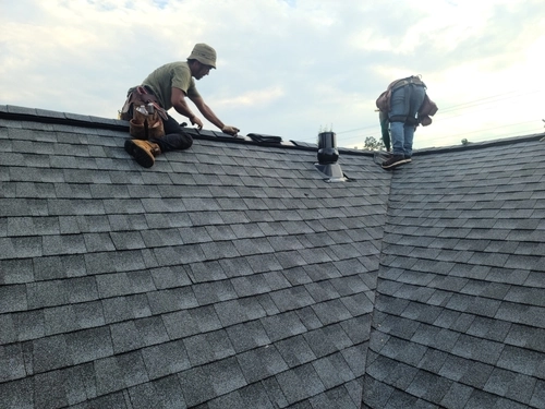 Asphalt shingles showing heat wear on an Arizona roof